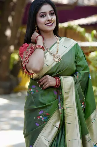 Green woven design zari paithani saree