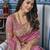 Pink ethnic motif embroidered zari woven saree