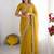 Yellow embellished beads and stones poly georgette heavy work saree