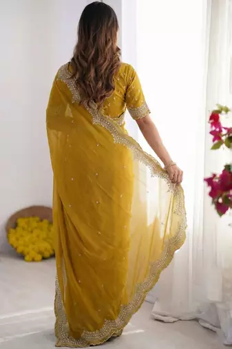 Yellow embellished beads and stones poly georgette heavy work saree