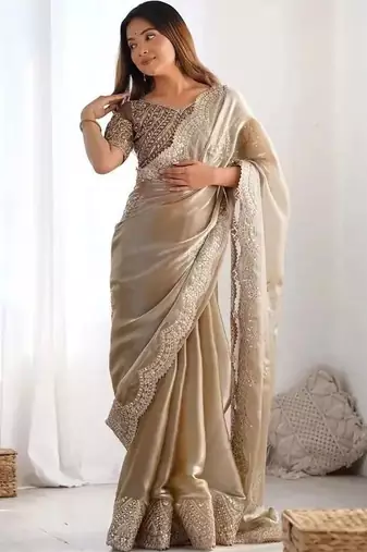 Beige ethnic motifs sequinned organza heavy work saree