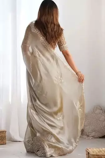 Beige ethnic motifs sequinned organza heavy work saree