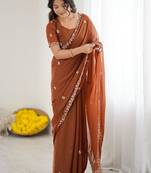 Rust embellished embroidered pure georgette heavy work saree
