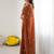 Rust embellished embroidered pure georgette heavy work saree