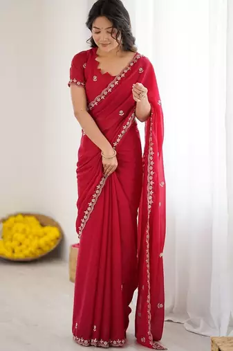 Red ethnic motifs embroidered pure georgette heavy work saree