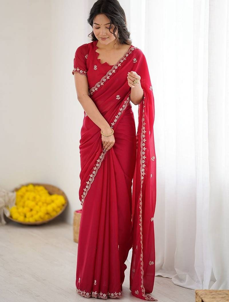Red ethnic motifs embroidered pure georgette heavy work saree