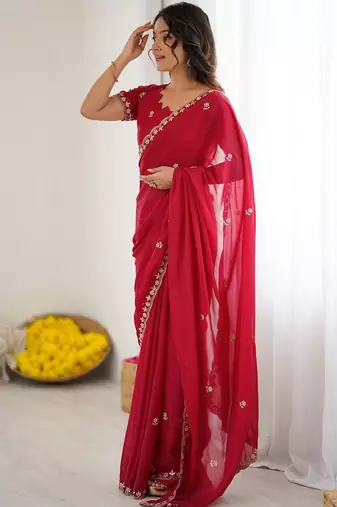 Red ethnic motifs embroidered pure georgette heavy work saree