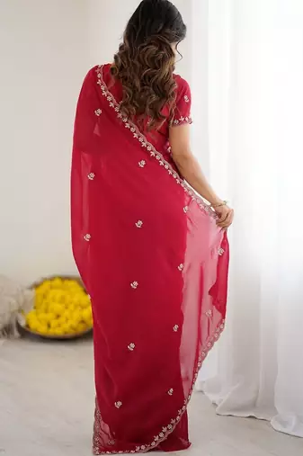 Red ethnic motifs embroidered pure georgette heavy work saree