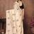 Cream floral embroidered organza saree