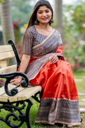 Orange ethnic motifs silk blend tussar saree