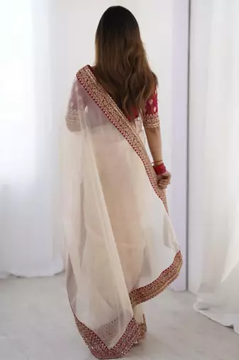 Peach embroidered net banarasi saree