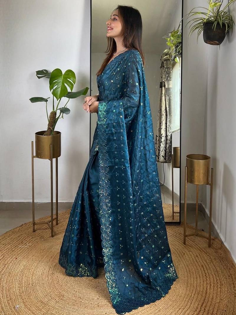 Teal embellished embroidered silk blend saree