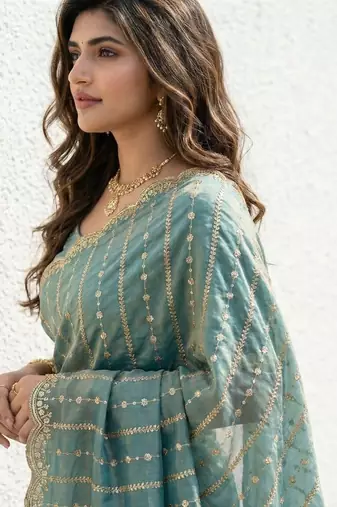Teal embellished zari satin heavy work saree