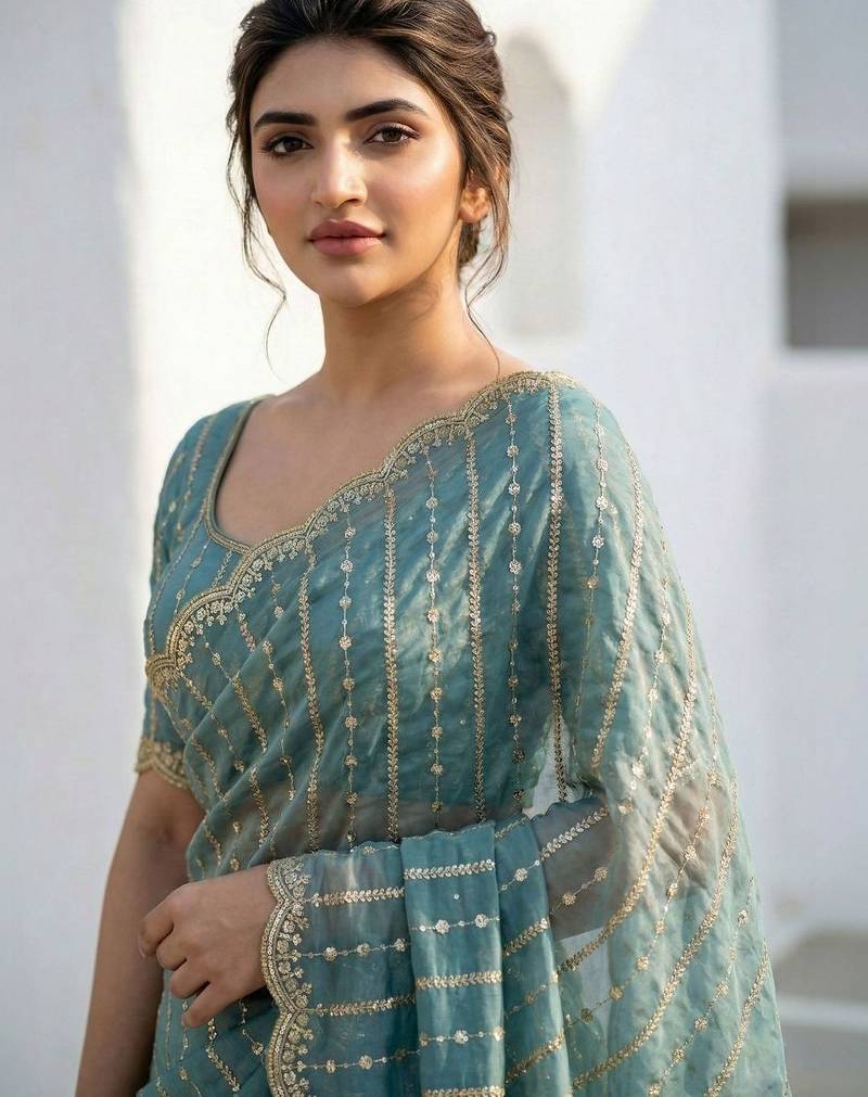 Teal embellished zari satin heavy work saree
