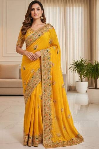 Yellow ethnic motifs embroidered organza heavy work saree