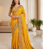Yellow ethnic motifs embroidered organza heavy work saree