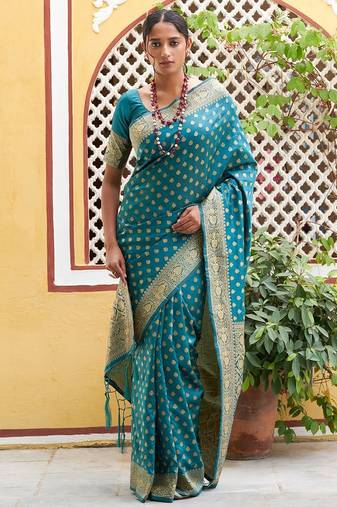 Green woven design zari silk blend saree