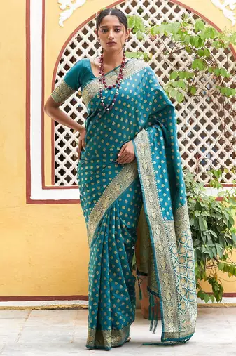 Green woven design zari silk blend saree