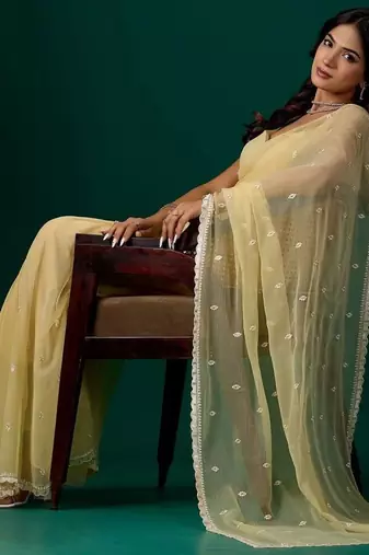 Yellow woven design embroidered pure chiffon saree
