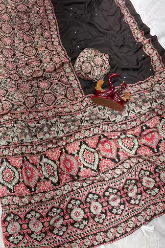 Dark Brown Color Ajarakh Print With Mirror Work And Beautiful Tussle Crepe Silk Saree