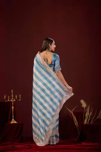 embellished blue stone and bead embroidery border chiffon saree with unstitched blouse