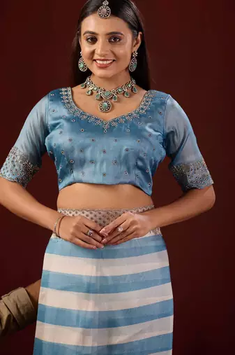 embellished blue stone and bead embroidery border chiffon saree with unstitched blouse