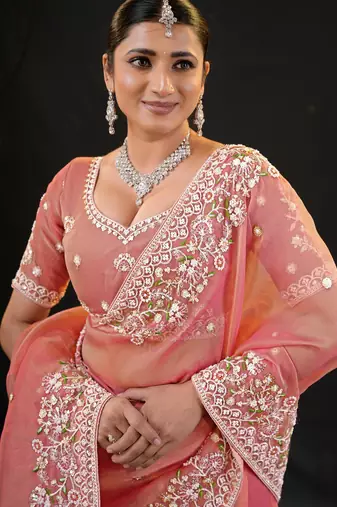 traditional peach pastel floral embroidered border kashmiri organza saree with unstitched blouse