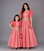 Mother daughter coral pink ruffled blouse with cotton zari lehenga set