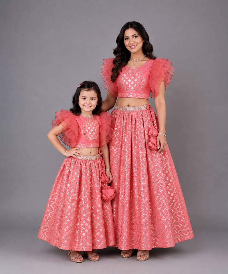 Mother daughter coral pink ruffled blouse with cotton zari lehenga set