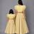 Mother daughter lime yellow organza frill chanderi lehenga set