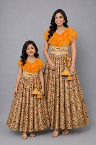 Mother daughter golden orange frill printed lehenga set