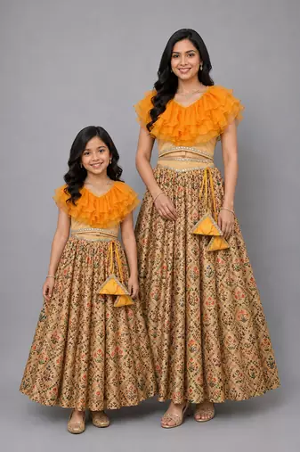 Mother daughter golden orange frill printed lehenga set
