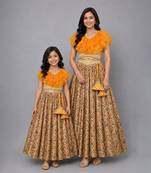 Mother daughter golden orange frill printed lehenga set
