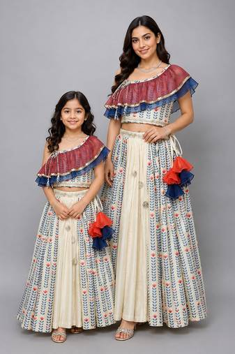 Mother daughter off white printed off shoulder ruffled blouse lehenga set