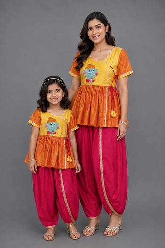 Mother daughter embroidered orange yellow dhoti set
