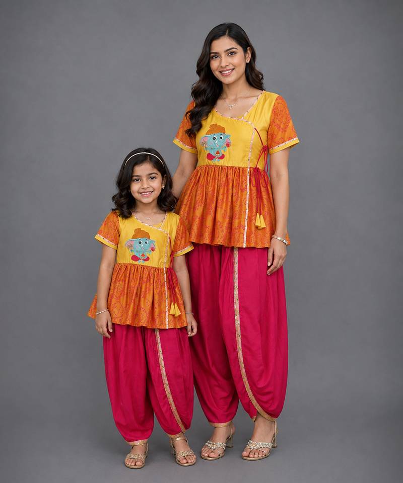 Mother daughter embroidered orange yellow dhoti set