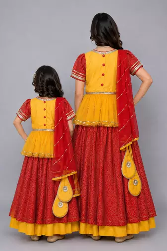 Mother daughter orange yellow peplum blouse lehenga set