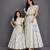 Mother daughter off white printed cotton silk lehenga set