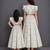 Mother daughter off white printed cotton silk lehenga set