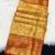 yellow woven kanchipuram silk blend saree with blouse piece