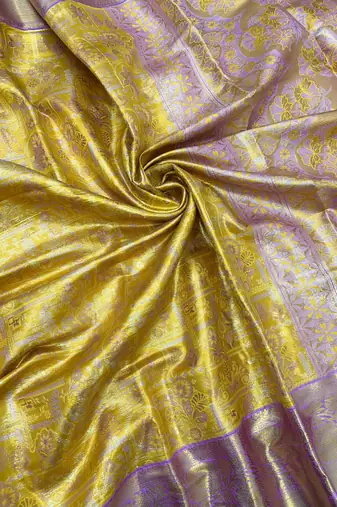 yellow woven kanchipuram silk blend saree with blouse piece