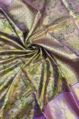 green woven kanchipuram silk blend saree with blouse piece