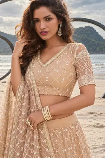BEIGE YELLOW NET THREAD WITH ZARI AND SEQUIN WORK FESTIVE LEHENGA CHOLI