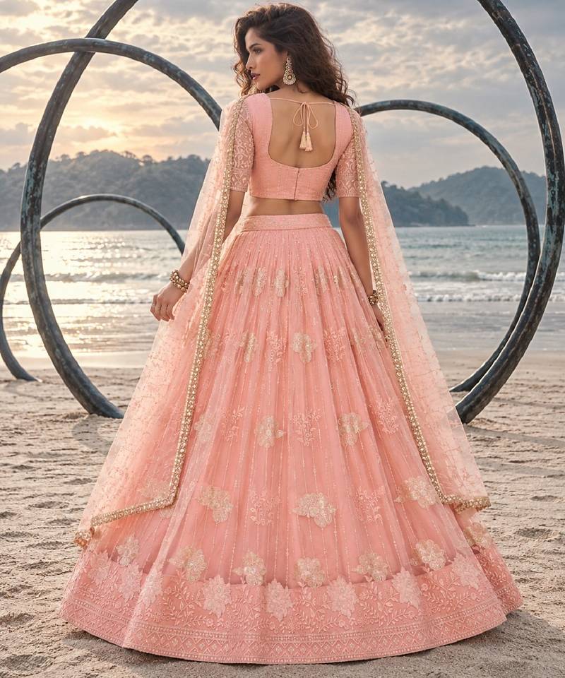 PEACH NET THREAD WITH ZARI AND SEQUIN WORK FESTIVE LEHENGA CHOLI