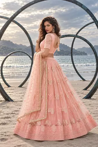 PEACH NET THREAD WITH ZARI AND SEQUIN WORK FESTIVE LEHENGA CHOLI