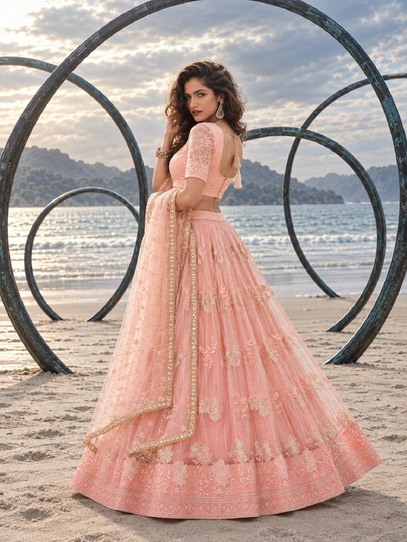 PEACH NET THREAD WITH ZARI AND SEQUIN WORK FESTIVE LEHENGA CHOLI