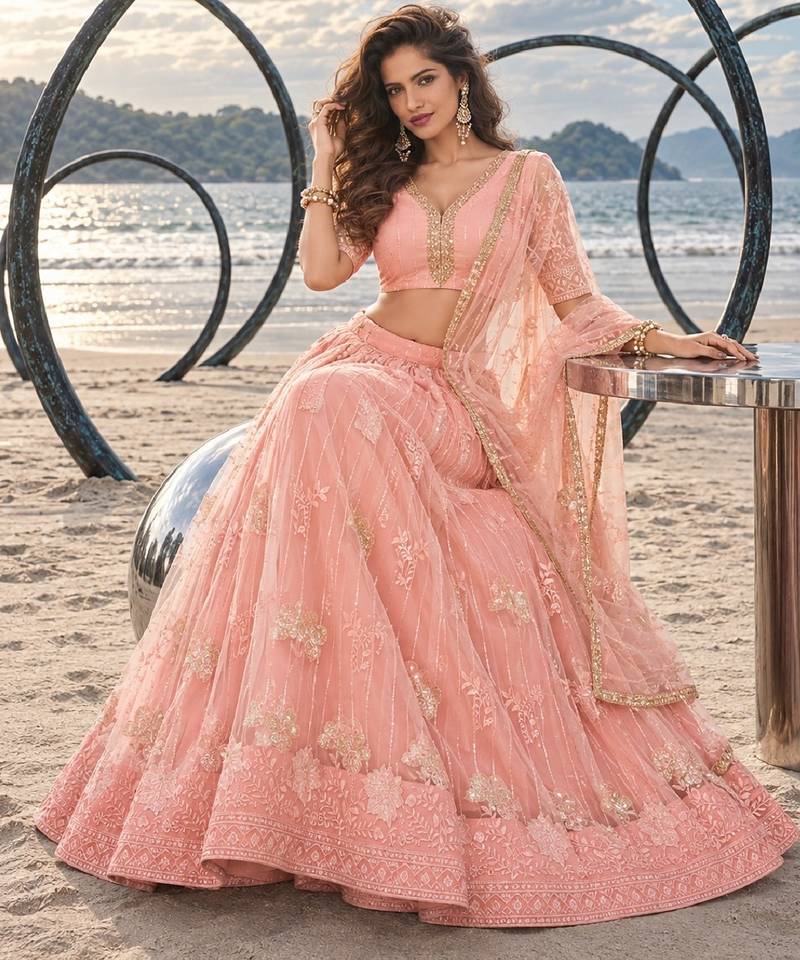 PEACH NET THREAD WITH ZARI AND SEQUIN WORK FESTIVE LEHENGA CHOLI