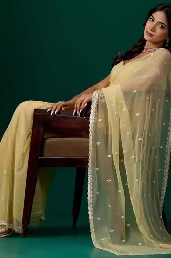 Yellow woven design embroidered  chiffon saree