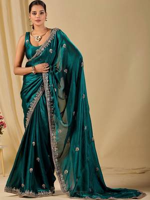 Teal ethnic motifs embroidered organza saree 1