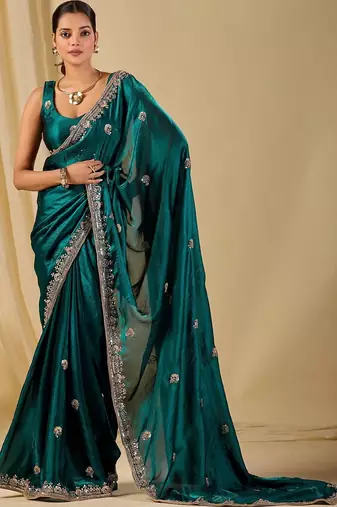 Teal ethnic motifs embroidered organza saree